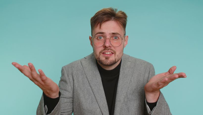 A person raises their hands with an indignant expression, asking what is the reason for the failure.