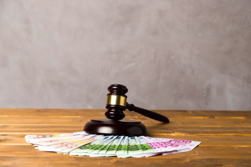 Assortment with judge gavel and euro banknotes.