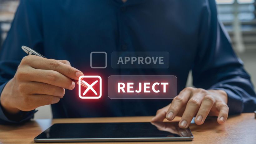 Businessman making reject selection on interactive digital approval system featuring advanced workflow.